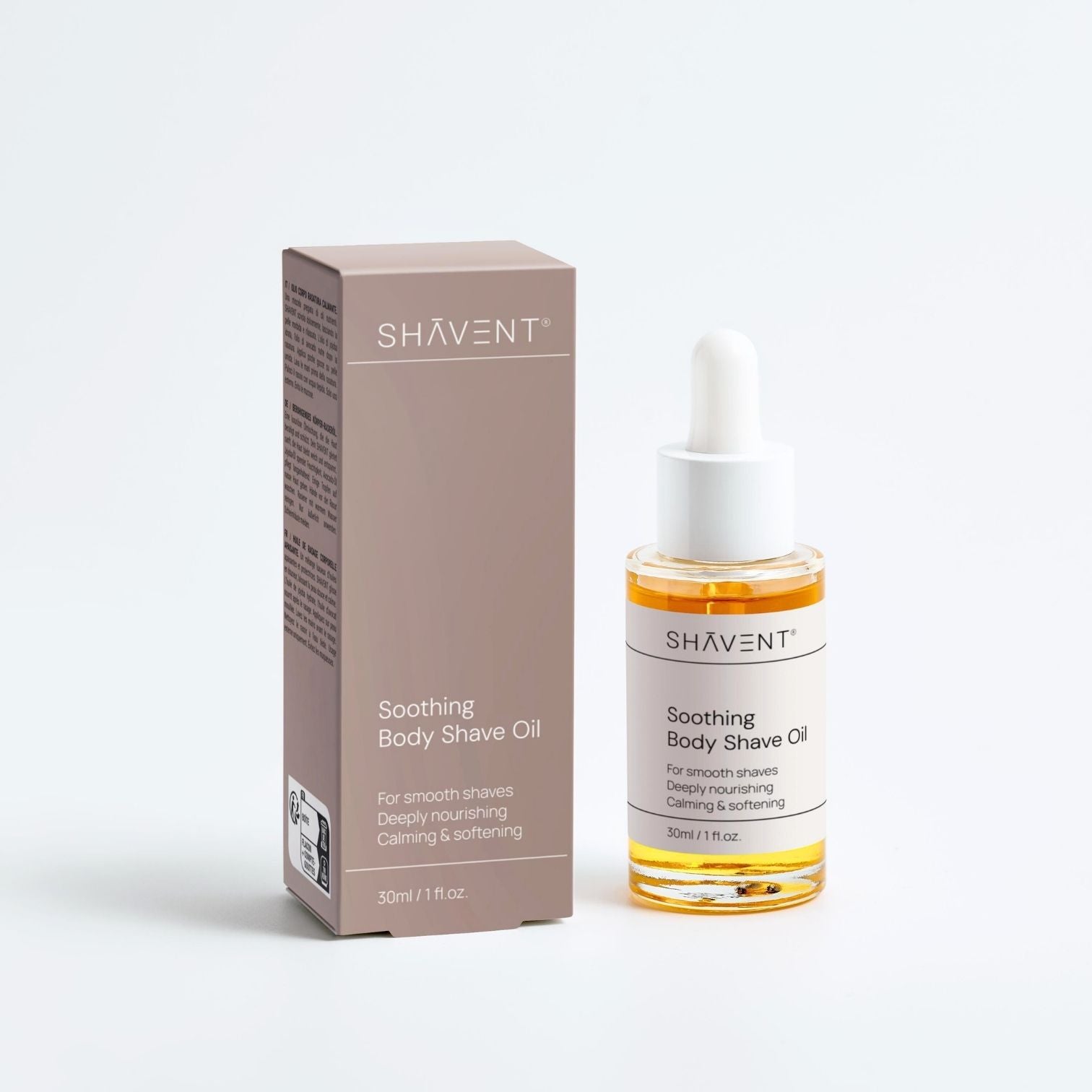 30 ml Flasche âShÄvent Soothing Body Shave Oilâ mit Etikett âfĂŒr glatte Rasuren, tiefenwirksam nĂ€hrendâ, neben passender Verpackung, im âDas groĂe SHAVENT Frauen-Geschenk-Setâ.