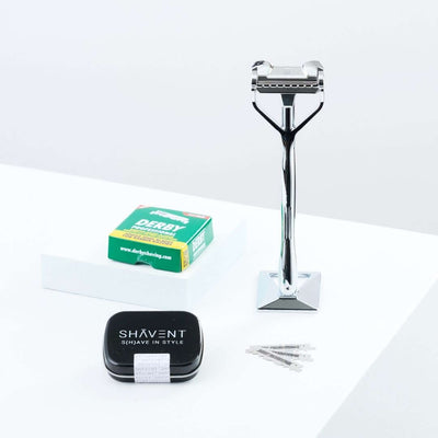 Rundum-Set: SHAVENT Original Schwingkopf-Rasierer, inklusive 100 Klingen und -sammeldose für plastikfreie, sanfte Rasur. Enthält Rasierer, Standfuß, Klingen und Aufbewahrungsdose.